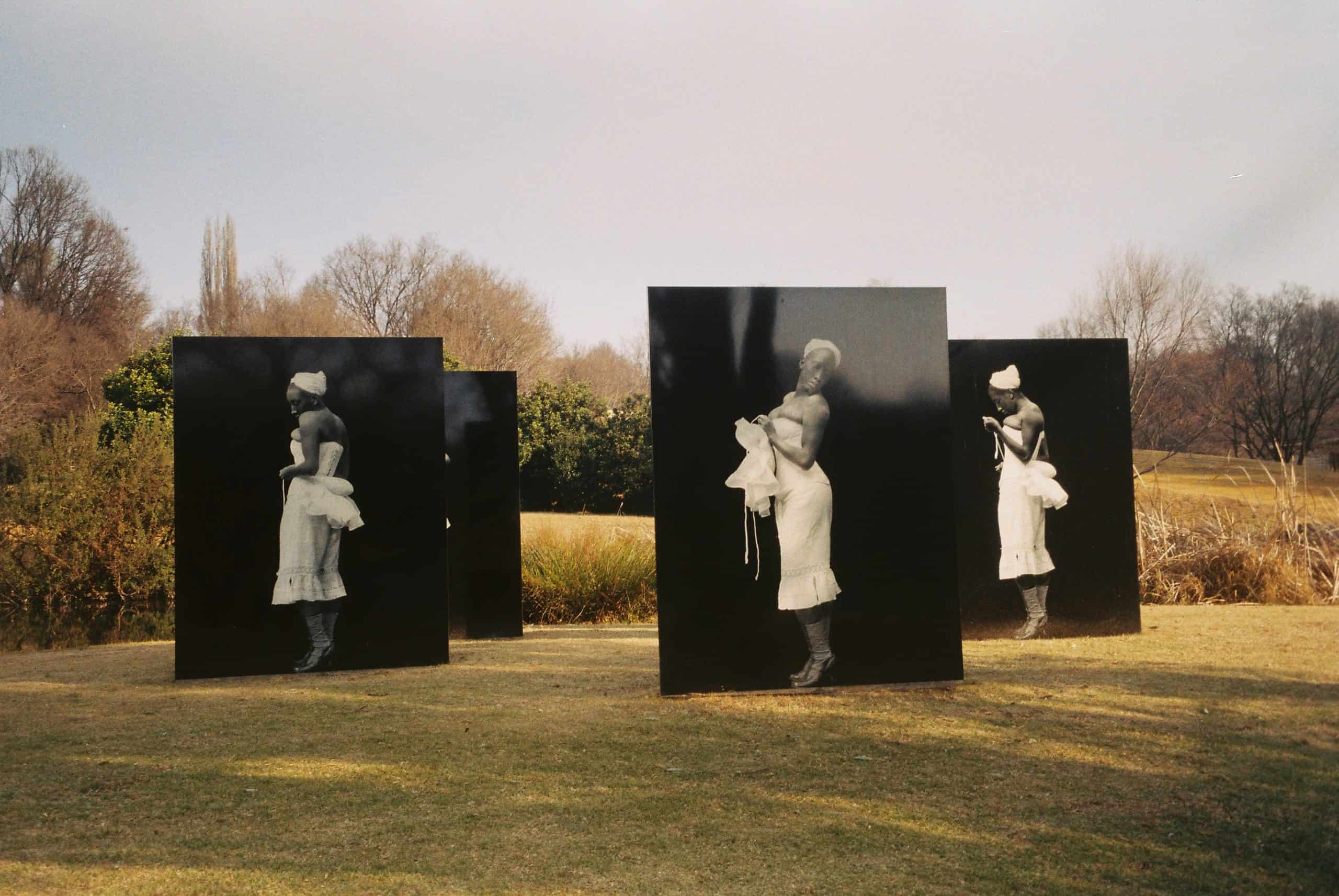 Image of an art installation at Nirox Sculpture Park, featuring black woman in olden day garms
